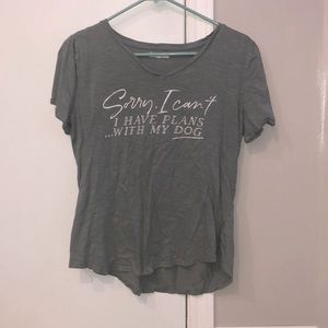 turquoise shirt with white lettering